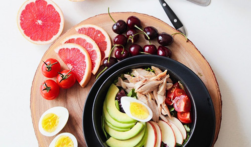 Vitamin-rich meal with fruits, vegetables, eggs, and lean protein to support bone health