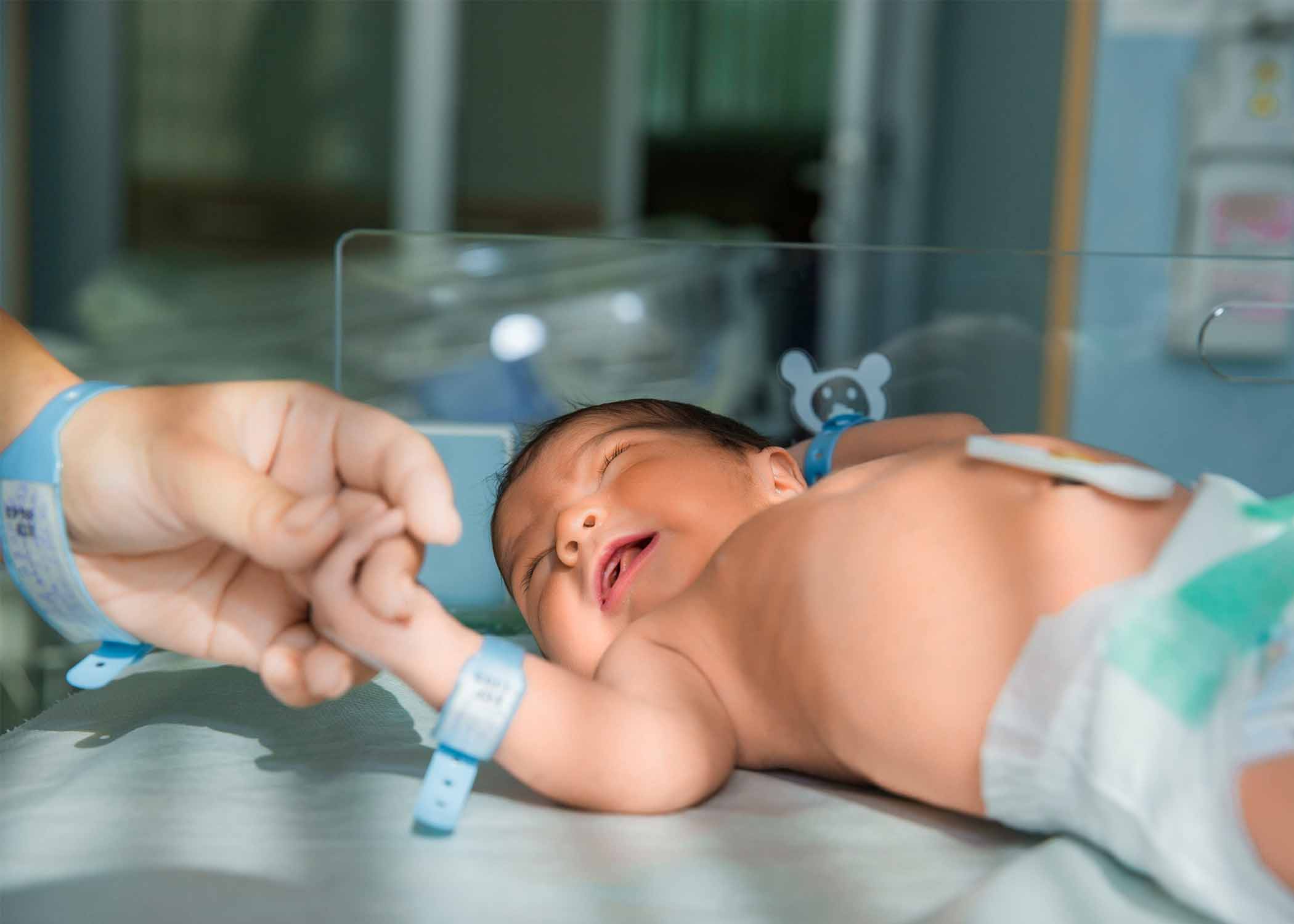 Doctor performing newborn check-up for early health monitoring and postnatal care