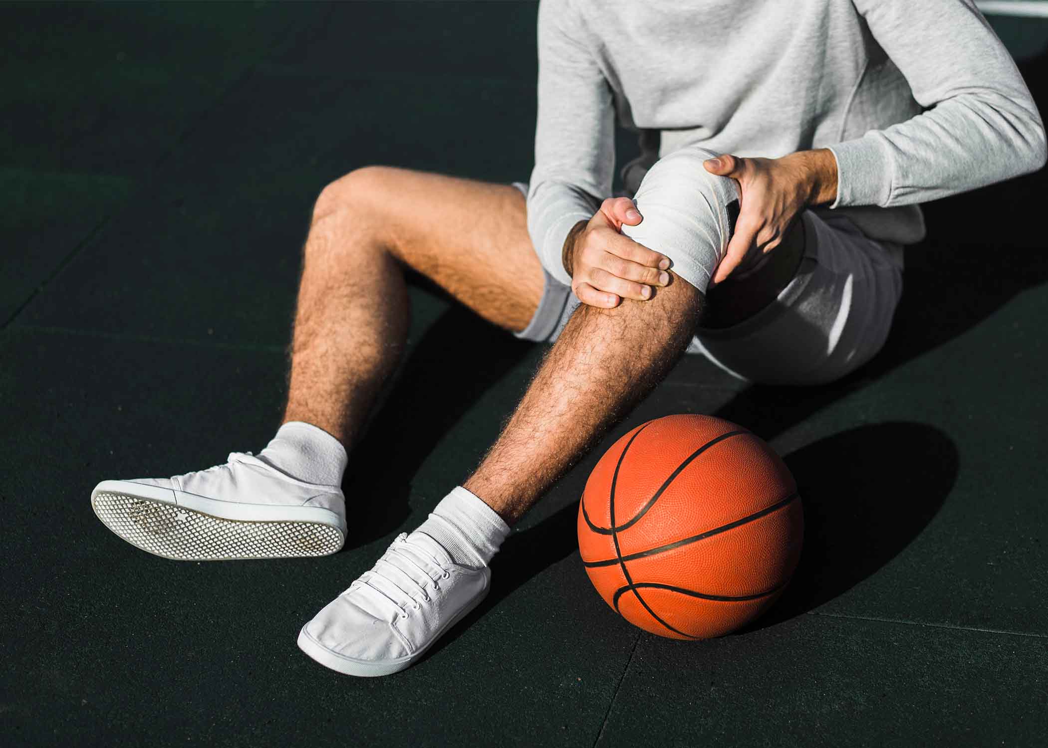 Orthopedic doctor treating sports injuries, joint pain, and movement-related muscle or ligament issues